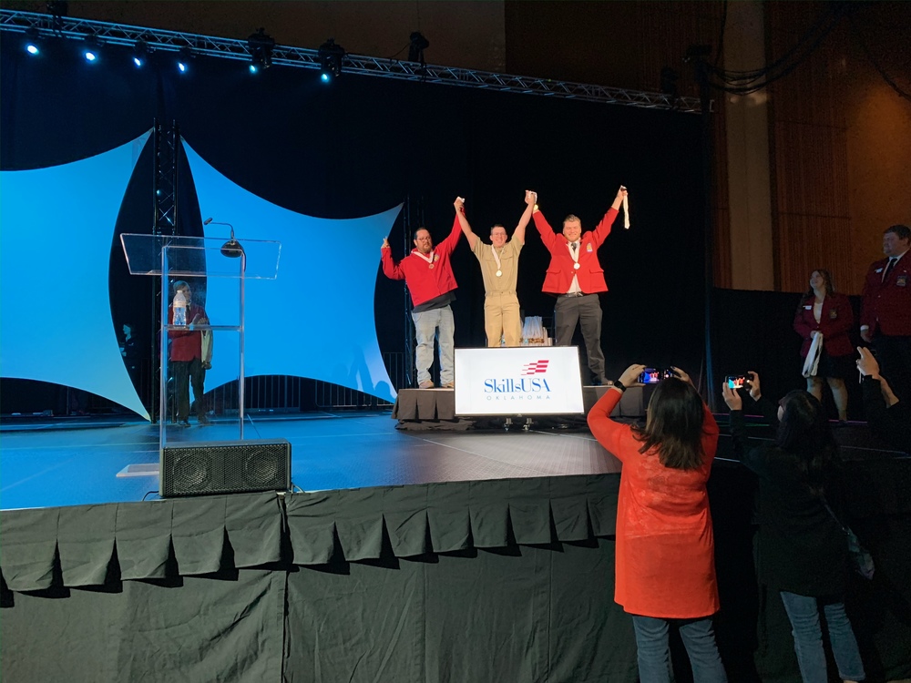 Three Students on a Podium at the State SkillsUSA Competition 