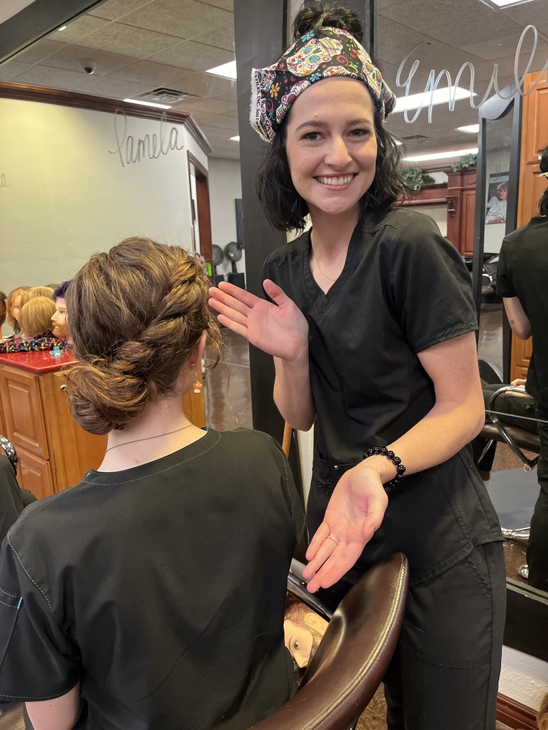 Student presents her hairstyle she did while blindfolded 